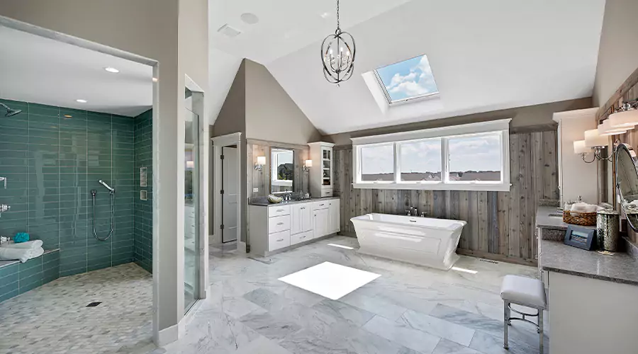 Modern bathroom featuring black vanity, round mirror, and beige tile walk-in shower with matte black fixtures
